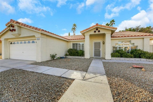 mediterranean / spanish-style house featuring a garage