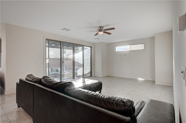 living room featuring ceiling fan and light tile patterned floors