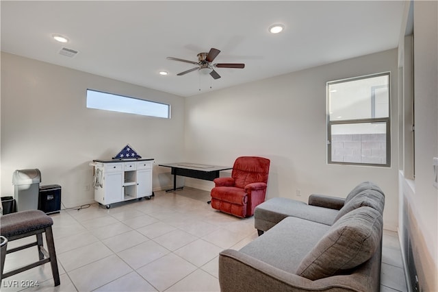 living room featuring ceiling fan and light tile patterned floors