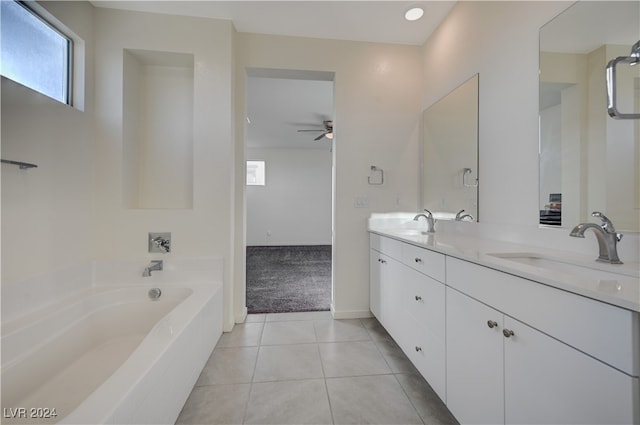 bathroom featuring a tub, ceiling fan, tile patterned flooring, and vanity