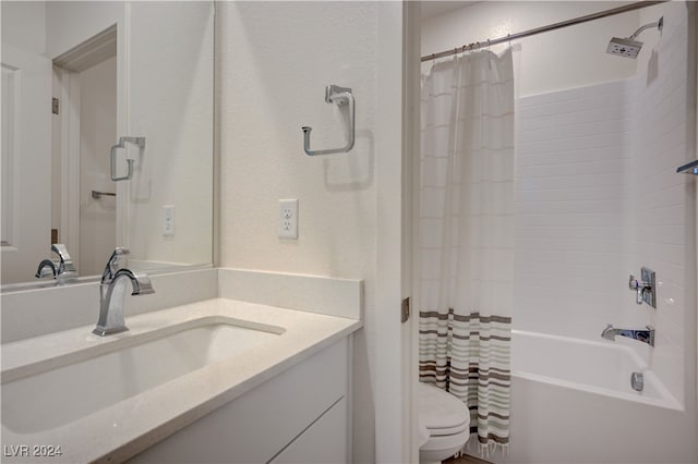 full bathroom with shower / tub combo with curtain, vanity, and toilet