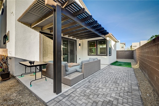 view of patio featuring outdoor lounge area and a pergola