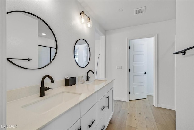 bathroom featuring vanity and wood-type flooring