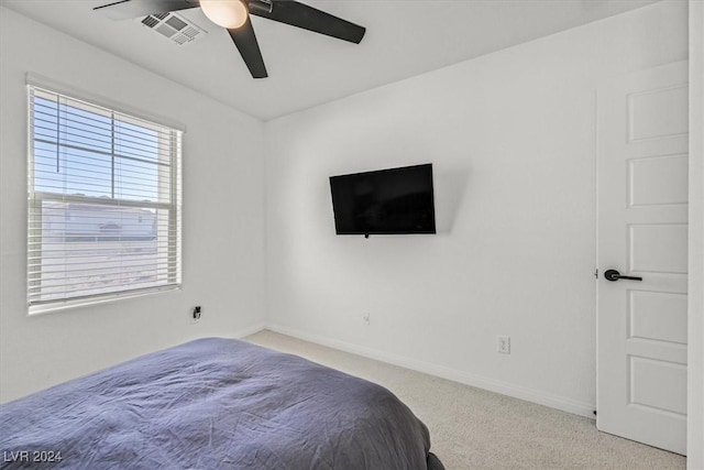 carpeted bedroom with ceiling fan