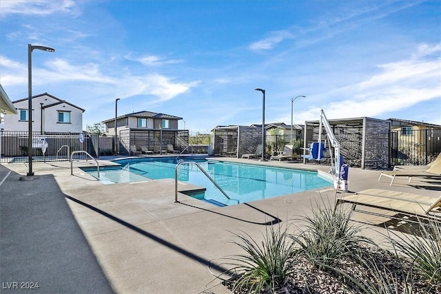 view of swimming pool featuring a patio