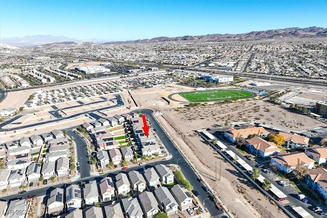 birds eye view of property with a mountain view