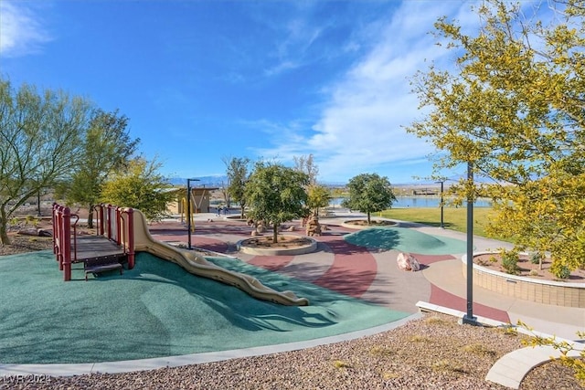 view of jungle gym featuring a water view