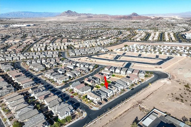 birds eye view of property featuring a mountain view