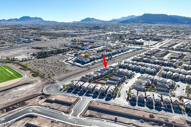 birds eye view of property featuring a mountain view