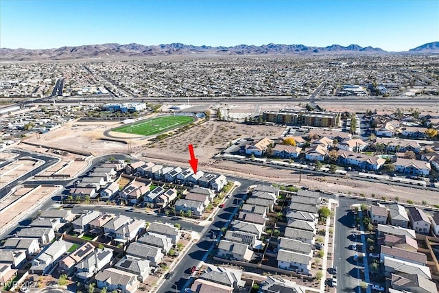 birds eye view of property with a mountain view