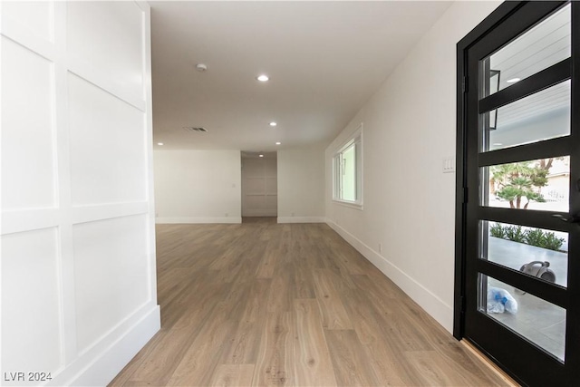 hall with light wood-type flooring