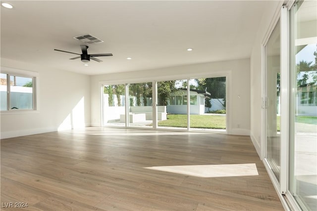 spare room with ceiling fan and hardwood / wood-style floors