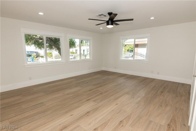 unfurnished room featuring ceiling fan and light hardwood / wood-style floors