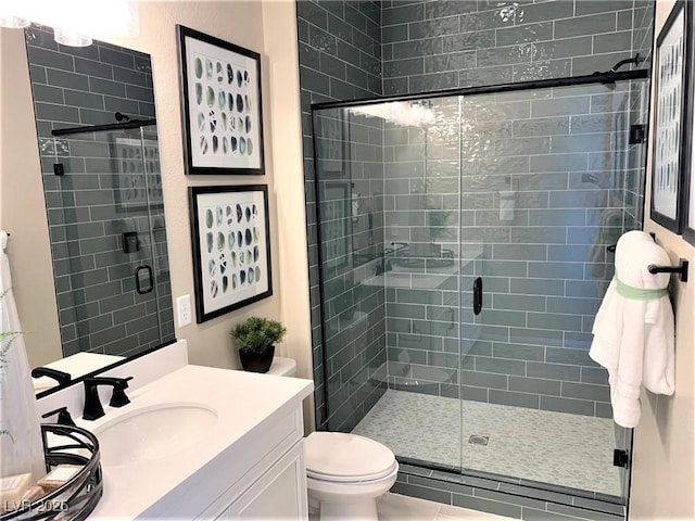 bathroom with vanity, toilet, and walk in shower