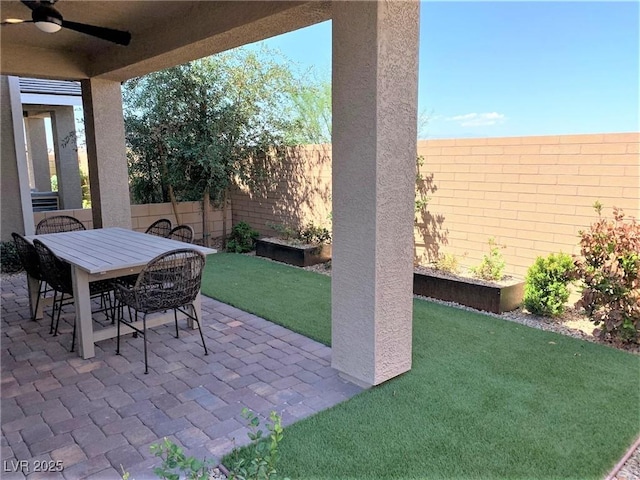 view of patio featuring ceiling fan