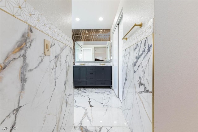 bathroom featuring vanity and a textured ceiling