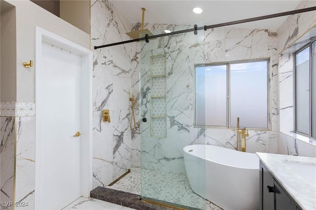 bathroom featuring separate shower and tub and vanity