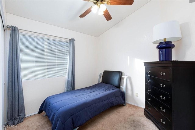 carpeted bedroom featuring ceiling fan and vaulted ceiling