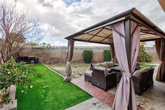 view of yard featuring a gazebo, an outdoor hangout area, and a patio area