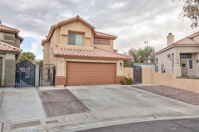 mediterranean / spanish house featuring a garage