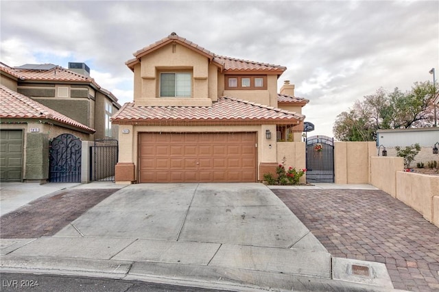 mediterranean / spanish-style home featuring a garage