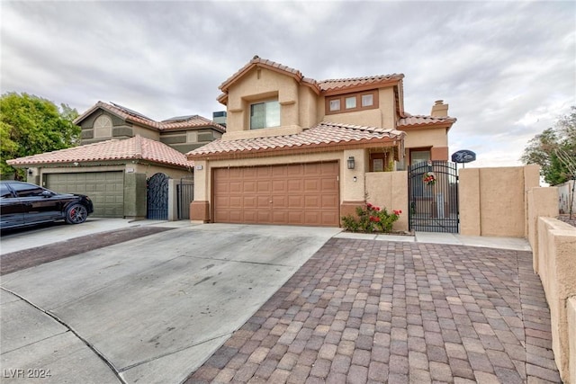 mediterranean / spanish-style house featuring a garage