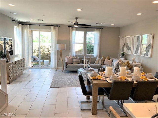 living room with ceiling fan and light tile patterned floors