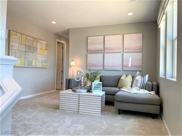 living area featuring light colored carpet