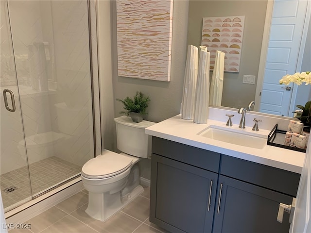 bathroom with tile patterned flooring, vanity, toilet, and an enclosed shower