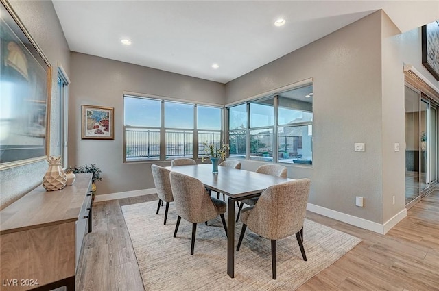 dining room featuring recessed lighting, light wood-style flooring, and baseboards