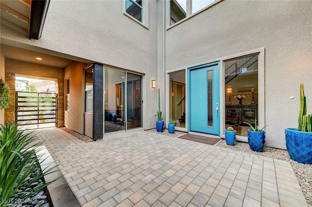 exterior space with a patio and stucco siding