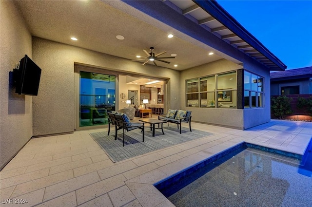 view of patio with an outdoor living space and a ceiling fan