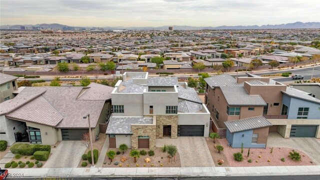 birds eye view of property featuring a mountain view