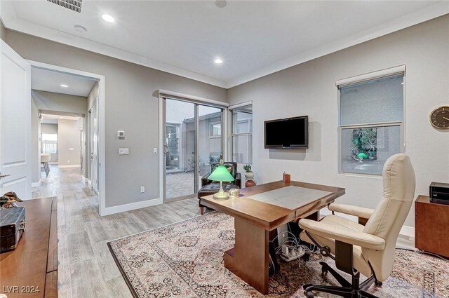 office featuring light hardwood / wood-style flooring and ornamental molding