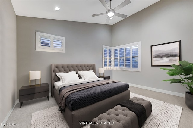 bedroom with a ceiling fan, recessed lighting, light colored carpet, and baseboards