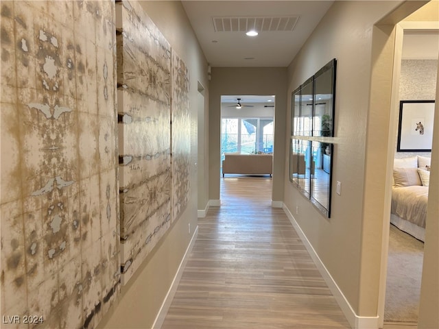 hallway featuring wood-type flooring