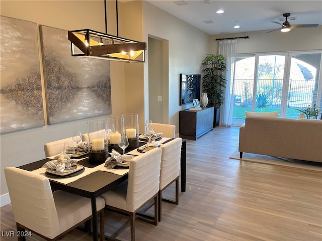 dining area featuring ceiling fan and hardwood / wood-style floors