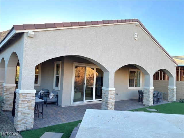 rear view of house featuring a patio area