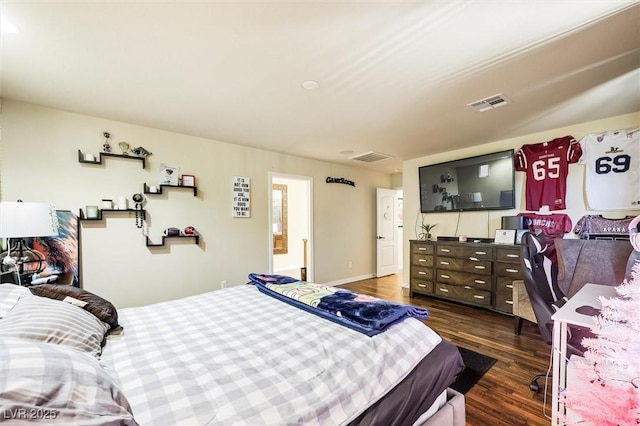 bedroom featuring dark hardwood / wood-style flooring