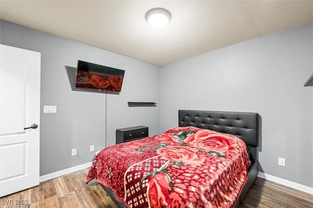 bedroom featuring hardwood / wood-style flooring