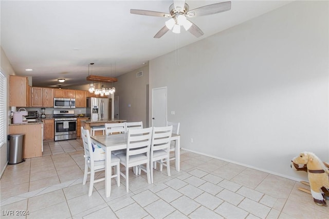 dining space featuring ceiling fan and light tile patterned flooring