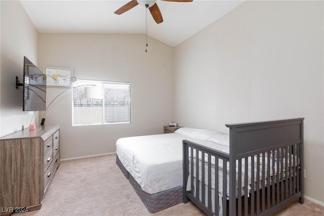 carpeted bedroom with ceiling fan and lofted ceiling