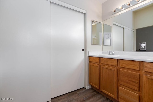 bathroom featuring vanity and wood-type flooring