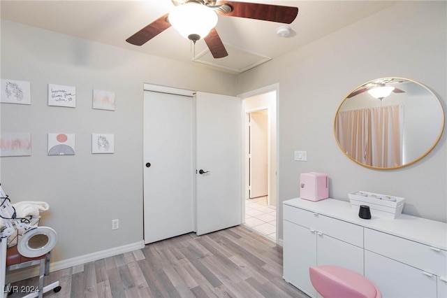 interior space featuring ceiling fan, light hardwood / wood-style floors, and a closet