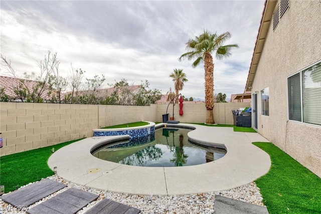 view of pool featuring a hot tub