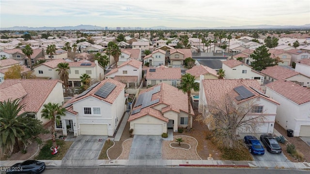 birds eye view of property with a mountain view