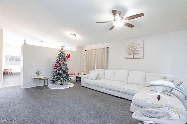 living room featuring carpet, ceiling fan, and lofted ceiling