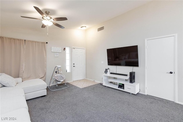 living room featuring ceiling fan and light colored carpet