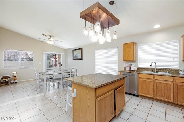 kitchen featuring dishwasher, a kitchen island, a healthy amount of sunlight, and sink