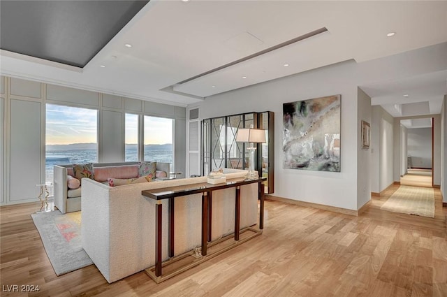 interior space featuring a water view and light hardwood / wood-style flooring